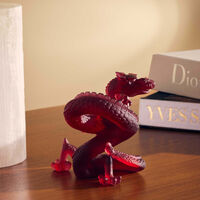 دوم منحوتة على شكل تنين صغيرة باللون الأحمر بإصدار محدود