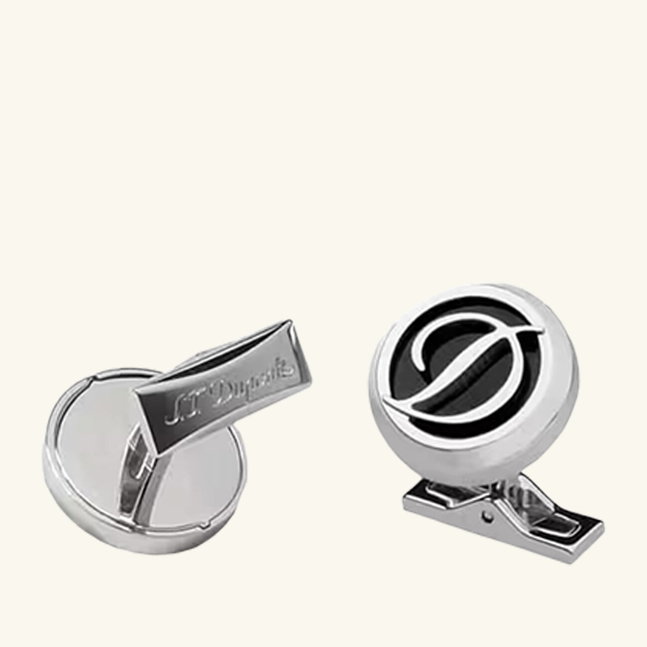s t  dupont paris is renowned for luxury lighters  collectible pens  perfumes  and premium accessories  founded in 1872  s t  dupont blends innovation with timeless elegance  featuring the iconic diamond head pattern and exceptional french craftsmanship in every handcrafted piece زر أكمام بشعار دائري