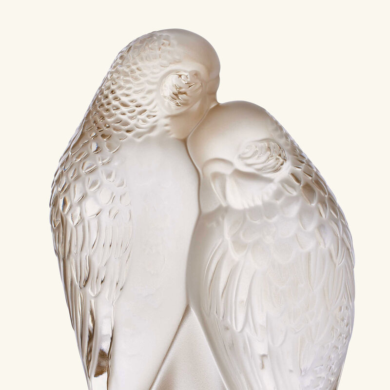 لاليك منحوتة صغيرة على شكل ببغاوين باللون الذهبي