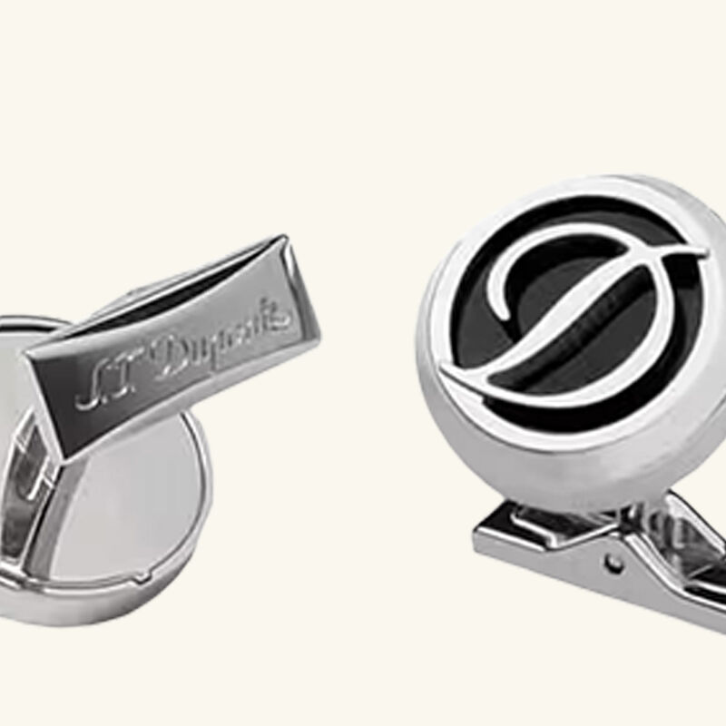 s t  dupont paris is renowned for luxury lighters  collectible pens  perfumes  and premium accessories  founded in 1872  s t  dupont blends innovation with timeless elegance  featuring the iconic diamond head pattern and exceptional french craftsmanship in every handcrafted piece زر أكمام بشعار دائري
